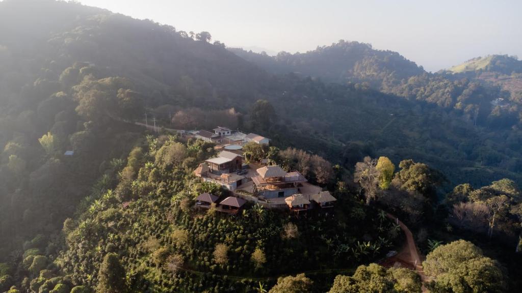 an aerial view of a house on a mountain at Mae Buya Coffee Farm Stay in Ban Huai Pong Nam Ron