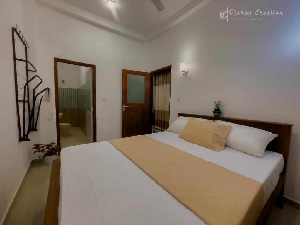 Postel nebo postele na pokoji v ubytování Villa 592A - Hikkaduwa