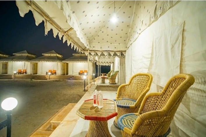 a room with chairs and a table in a tent at The Majestic Heaven Resort in Sām