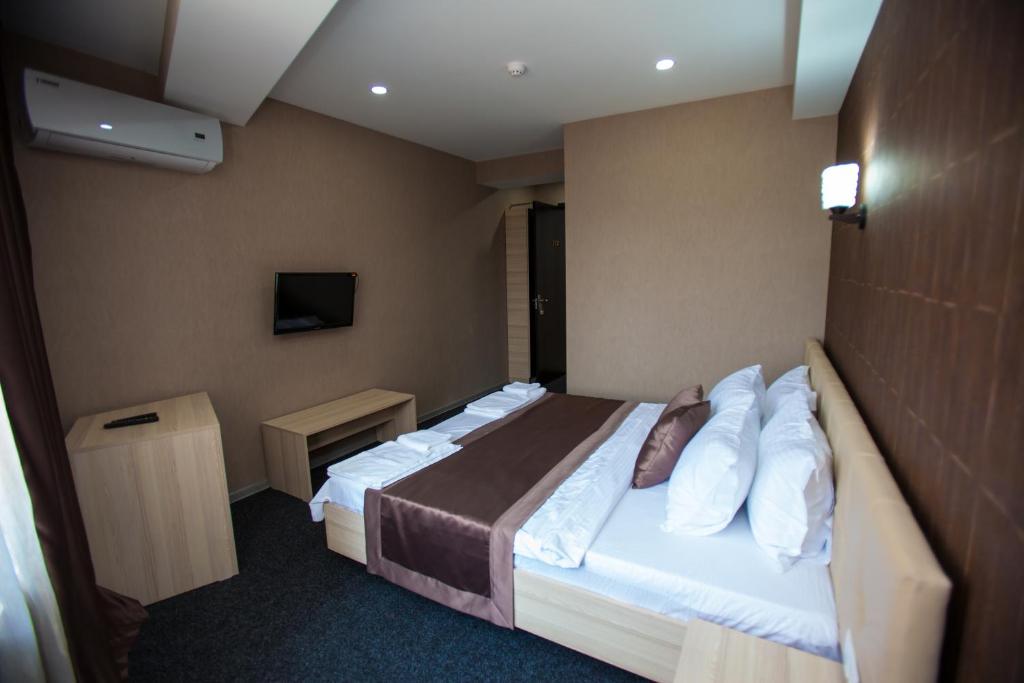 Postel nebo postele na pokoji v ubytování Hotel Voyager