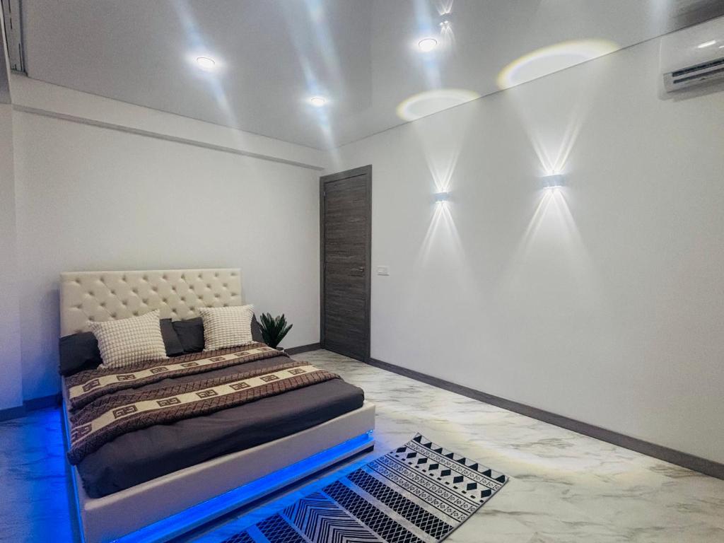 a bedroom with a bed and lights on the wall at Apartment in Salou in Salou