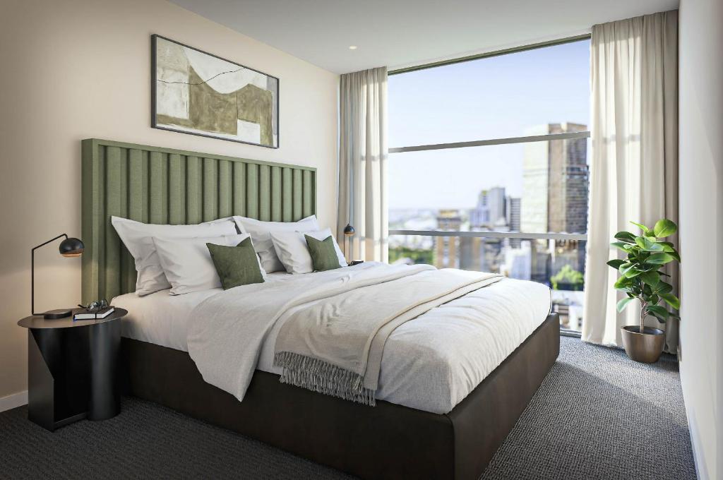 Postel nebo postele na pokoji v ubytování Nolo Apartments Lonsdale St