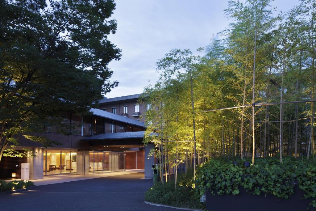 a building with trees in front of it at Hyatt Regency Kyoto in Kyoto