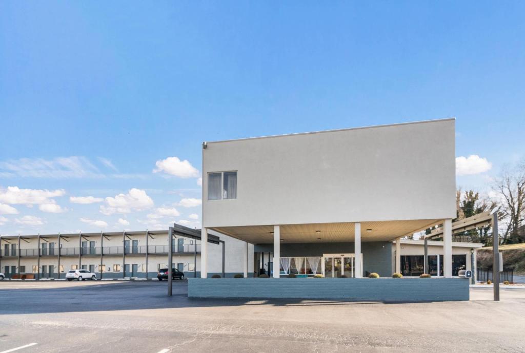 a large white building in front of a parking lot at Quality Inn - On The Lake Clarksville-Boydton in Clarksville