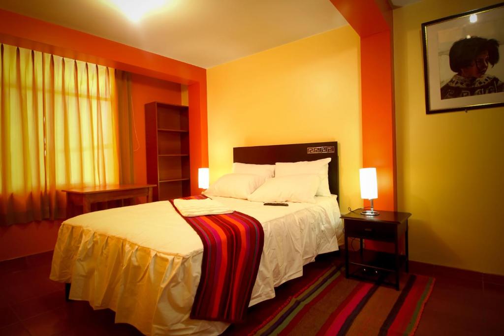 Postel nebo postele na pokoji v ubytování Olimpo Inn