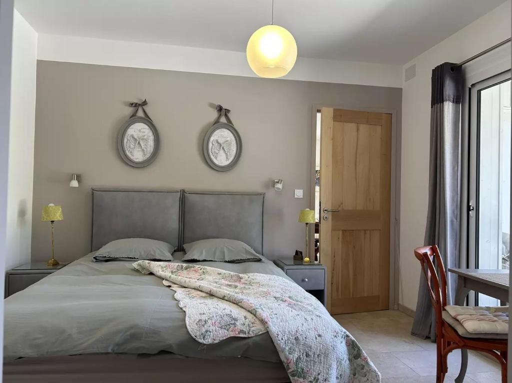 Voodi või voodid majutusasutuse Au Ciel Étoilé toas