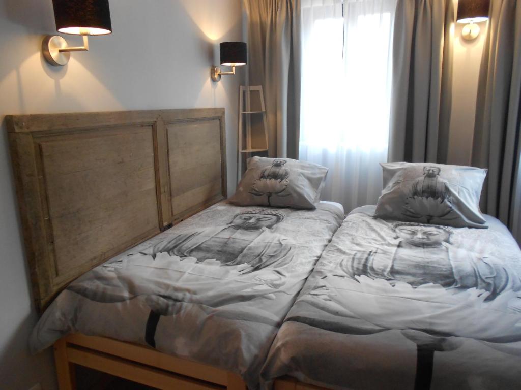 Postel nebo postele na pokoji v ubytování BnB City