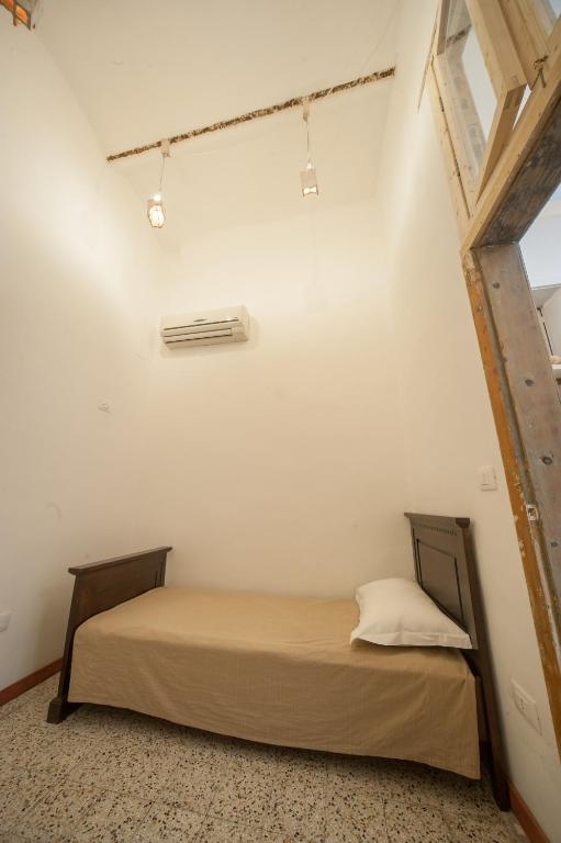 Postel nebo postele na pokoji v ubytování Suite San Giorgio