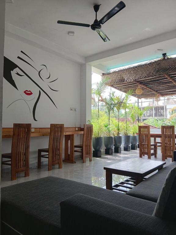 a dining room with a table and chairs at Lakmali Homestay 2 in Weligama