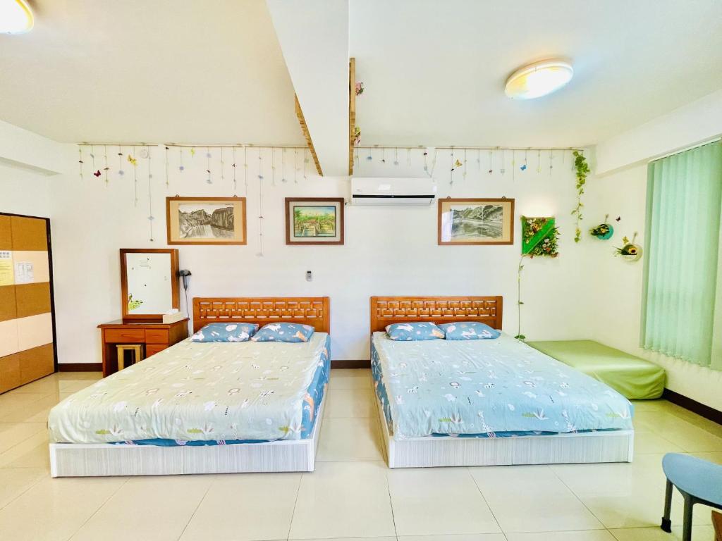 Ένα ή περισσότερα κρεβάτια σε δωμάτιο στο Lohas-artist B&B