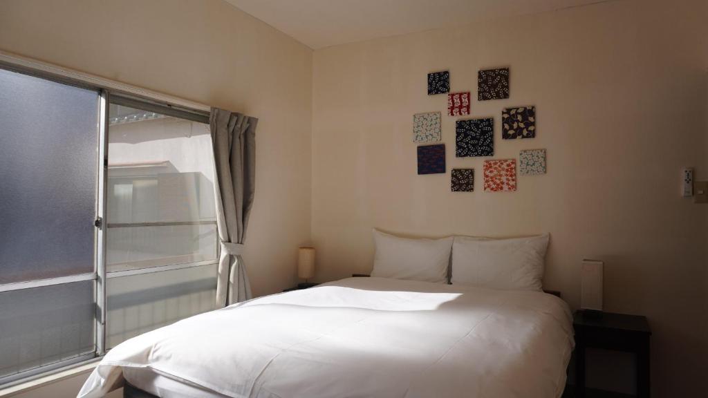 Ένα ή περισσότερα κρεβάτια σε δωμάτιο στο Ikebukuro