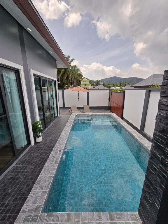 a swimming pool on the roof of a house at TiTIME POOL VILLA in Ao Nang 