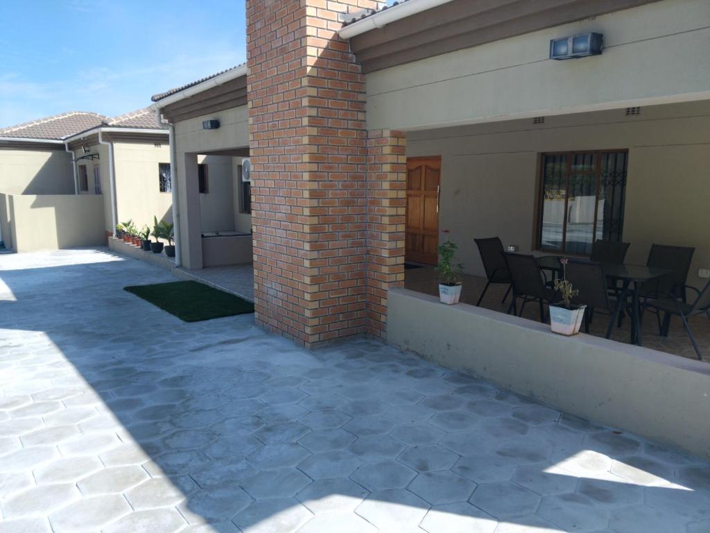 a patio of a house with a brick pillar at Family Home In Maun in Maun