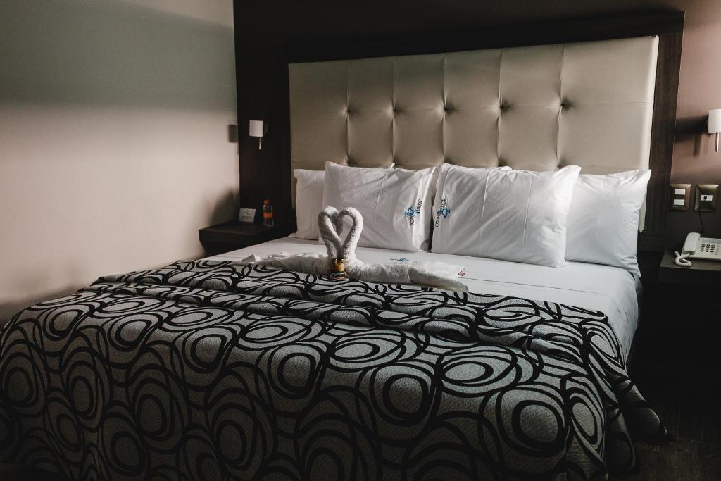 Postel nebo postele na pokoji v ubytování Hotel Flamingo Merida