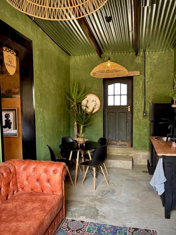 a living room with a couch and a table at One Eye Dog in Koringberg