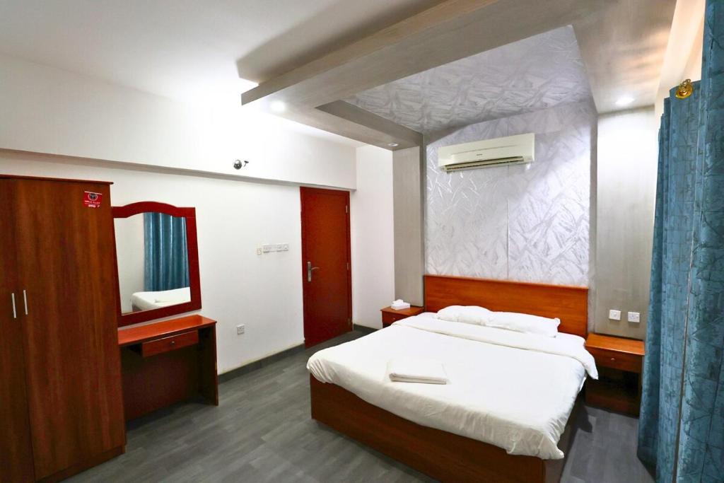 Postel nebo postele na pokoji v ubytování Muscat Seeb 2BR-Azure Heights where comfort meets