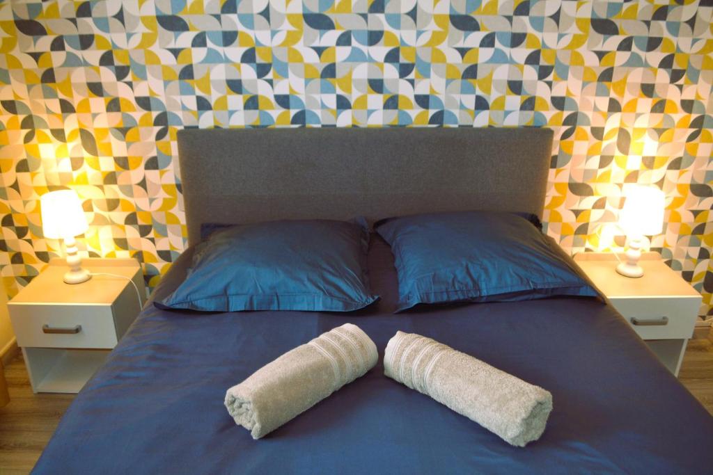 En eller flere senge i et værelse på L'Ancre Bleue