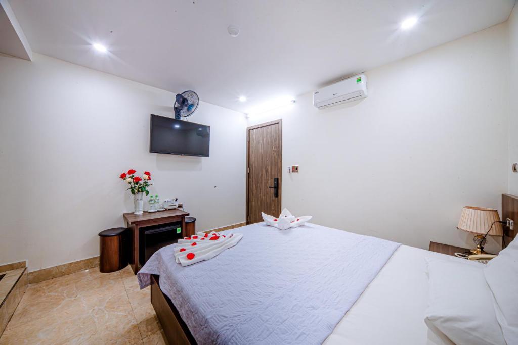 Postel nebo postele na pokoji v ubytování Thu Ha Hotel