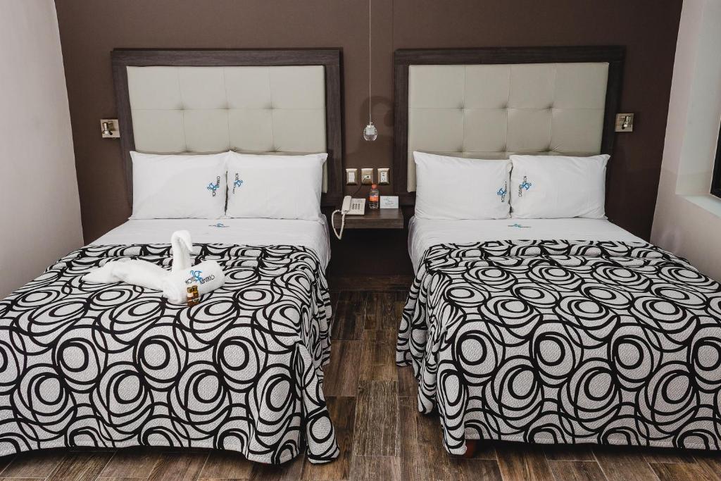 Postel nebo postele na pokoji v ubytování Hotel Flamingo Merida