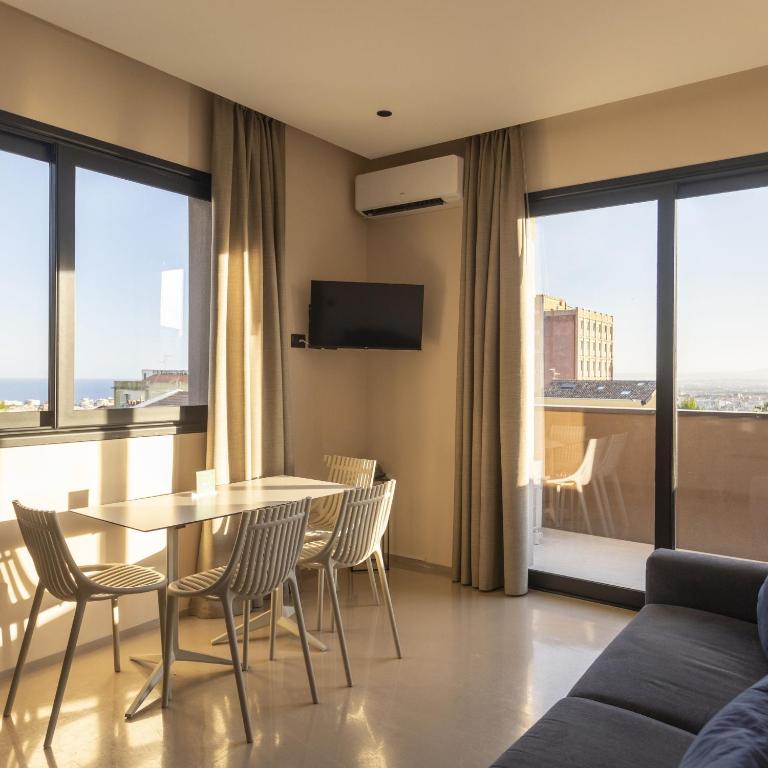 Et opholdsområde på Charming studio in an elegant residence in Catania