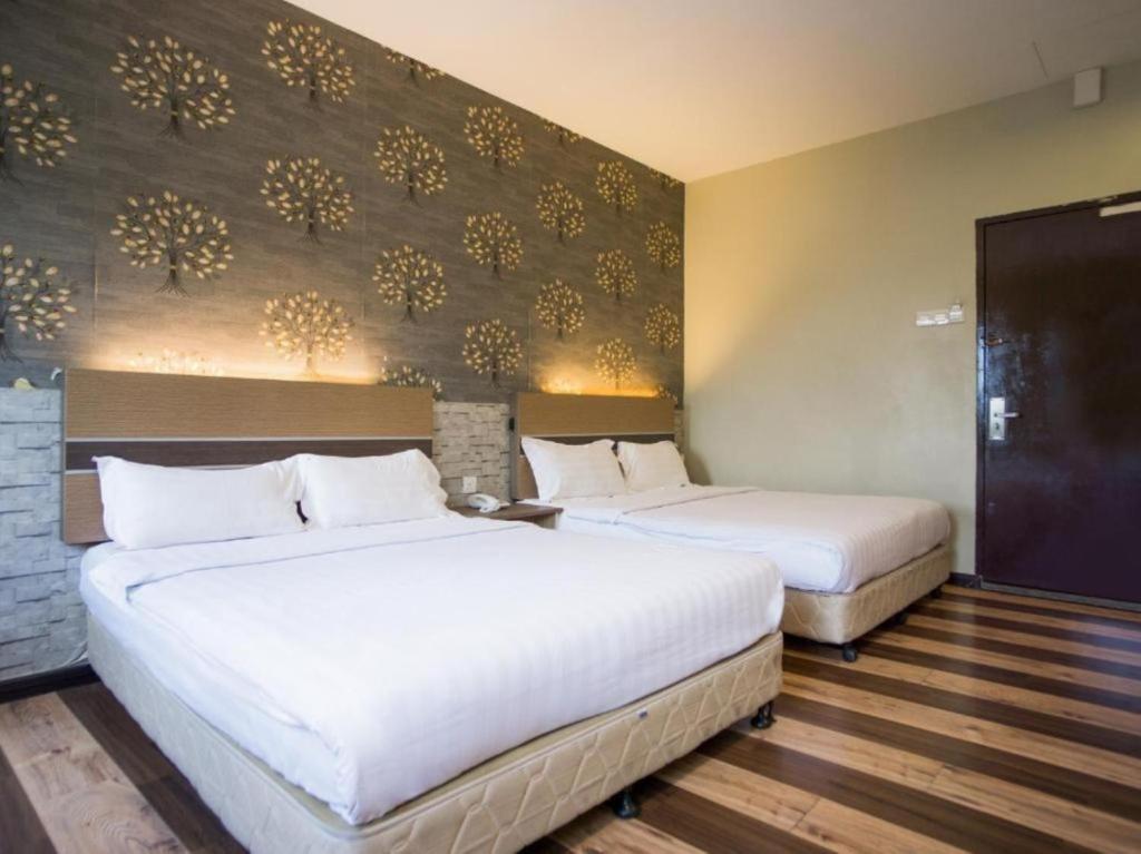 Ένα ή περισσότερα κρεβάτια σε δωμάτιο στο Swing & Pillows - Sky Star, KLIA 1 KLIA 2, Sepang