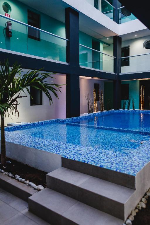 Bazén v ubytování Hotel Flamingo Merida nebo v jeho okolí