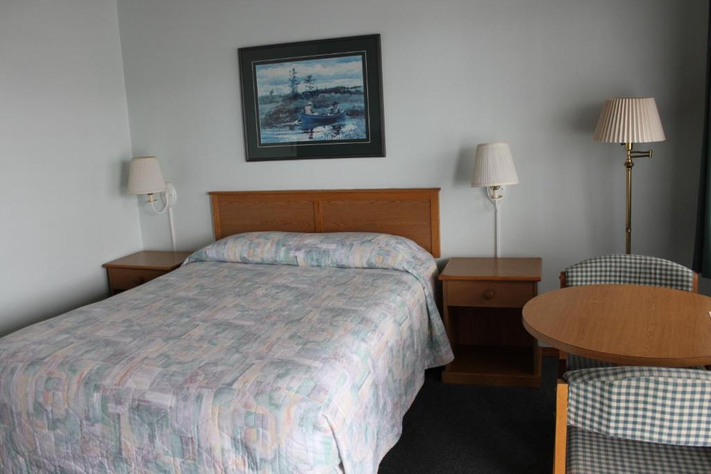 Postel nebo postele na pokoji v ubytování Azalea Lodge