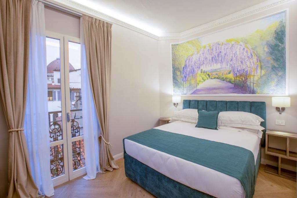 Postel nebo postele na pokoji v ubytování Hotel Settefiori