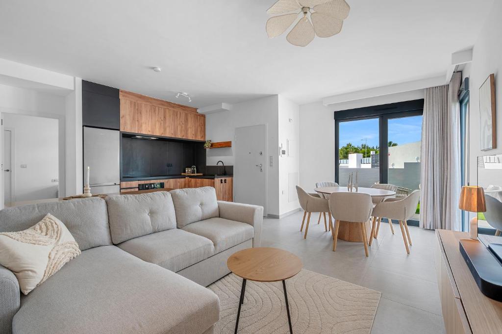 a living room with a couch and a table at Casa Jette in San Miguel de Salinas