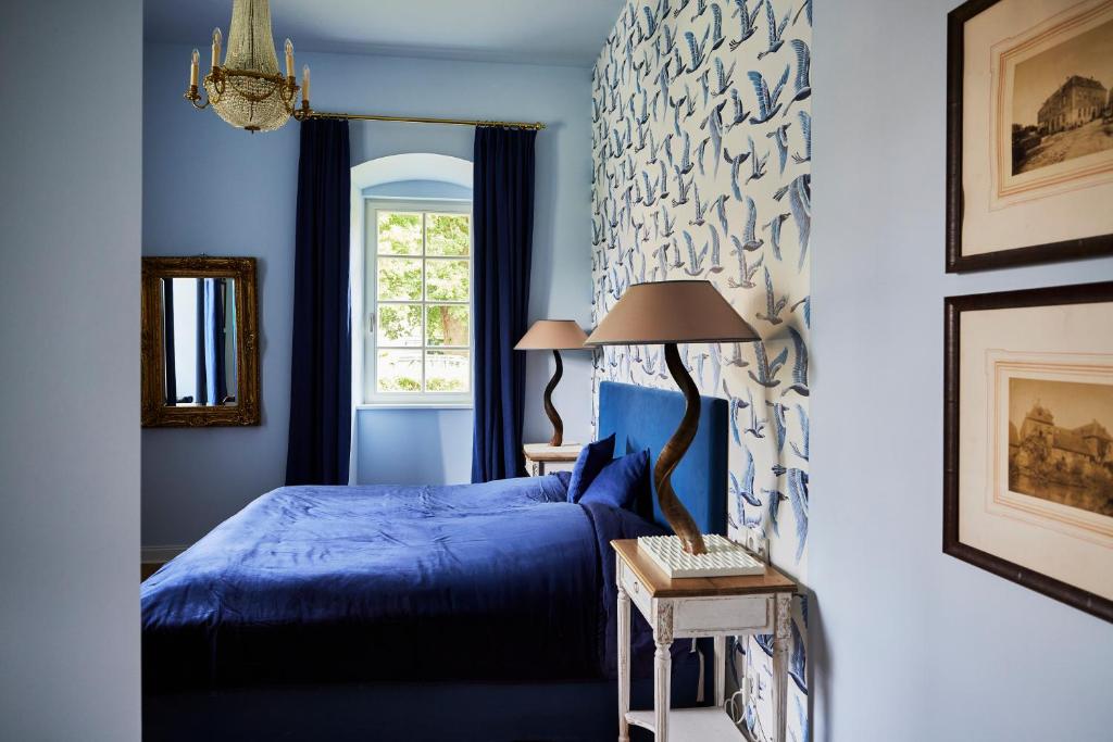 Ένα ή περισσότερα κρεβάτια σε δωμάτιο στο Schloss Hotel Alte Rentkammer