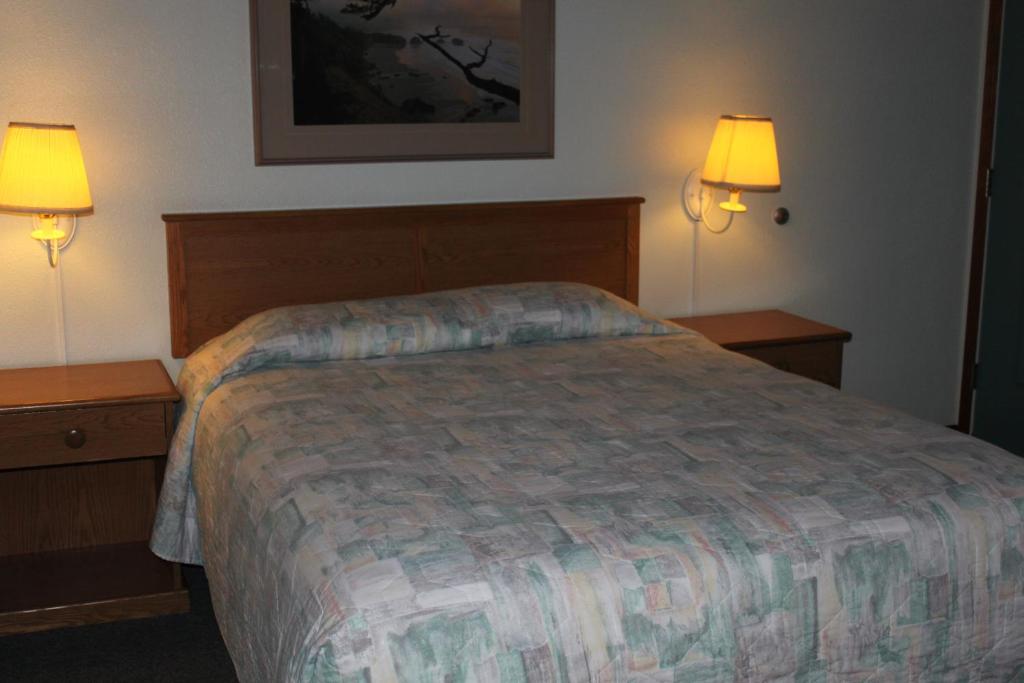 Postel nebo postele na pokoji v ubytování Azalea Lodge