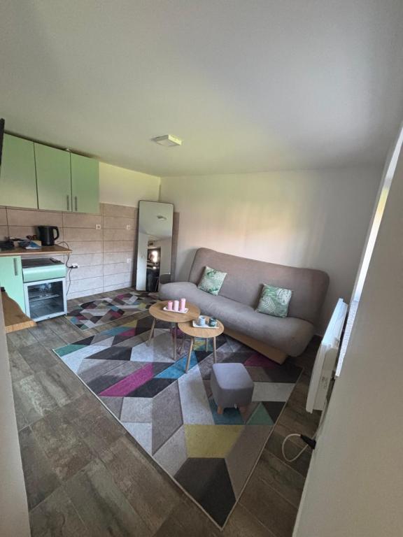 a living room with a couch and a table at Sunny Garden Old Town in Sarajevo