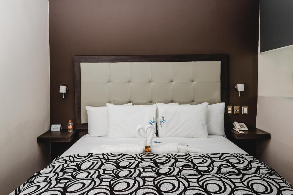 Postel nebo postele na pokoji v ubytování Hotel Flamingo Merida