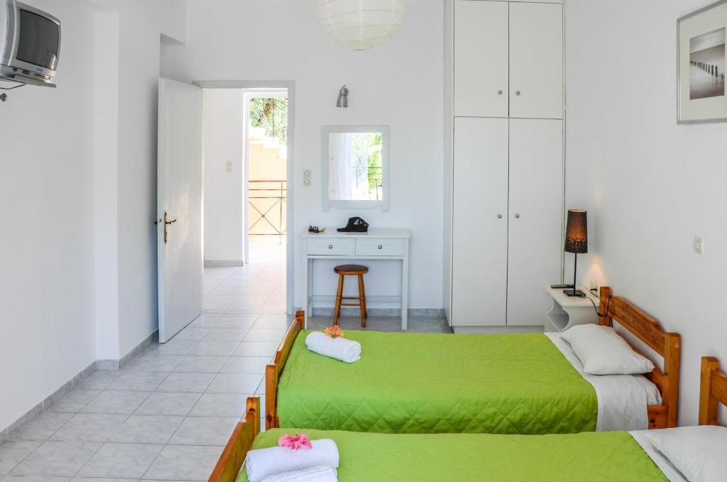 Postel nebo postele na pokoji v ubytování Olive Grove Apts