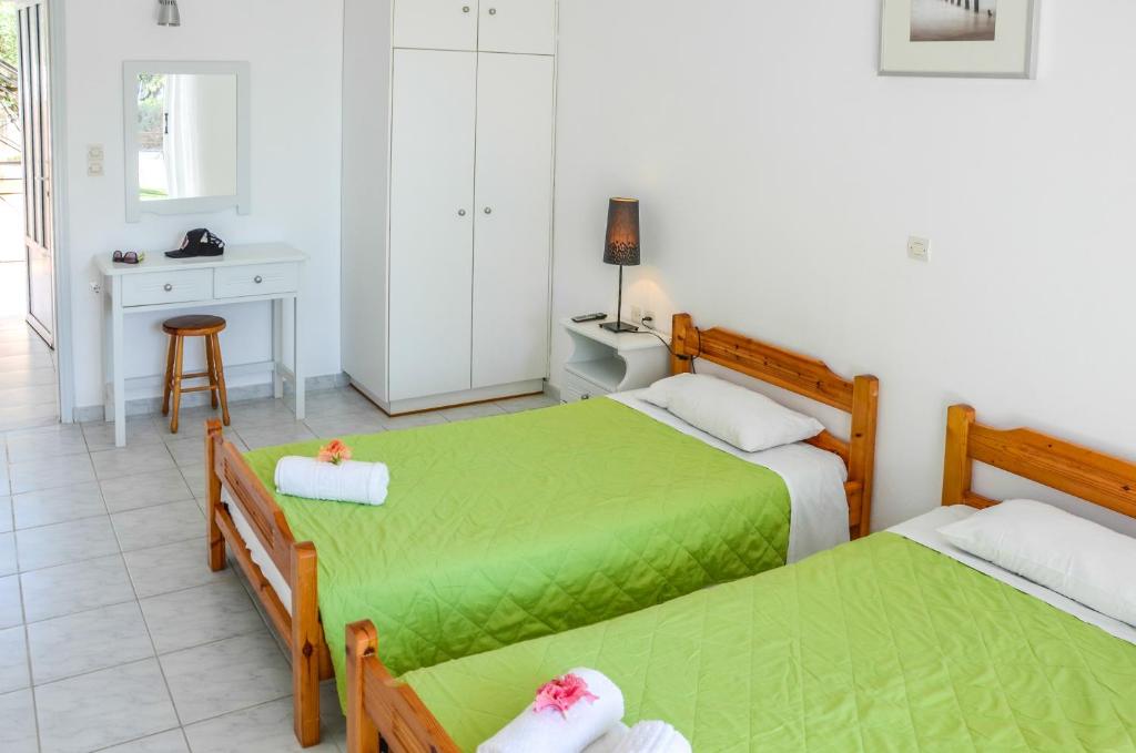 Postel nebo postele na pokoji v ubytování Olive Grove Apts