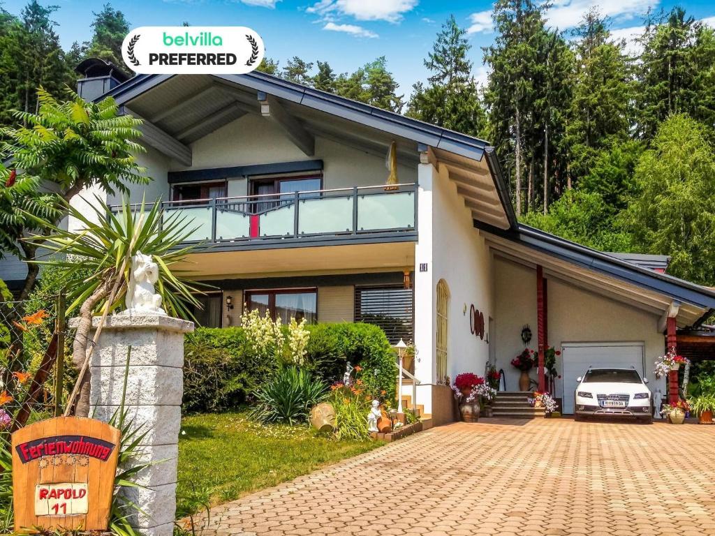 una casa con una entrada para autos en frente de ella en Apartment in Eberndorf near Petzen Ski Area, en Eberndorf