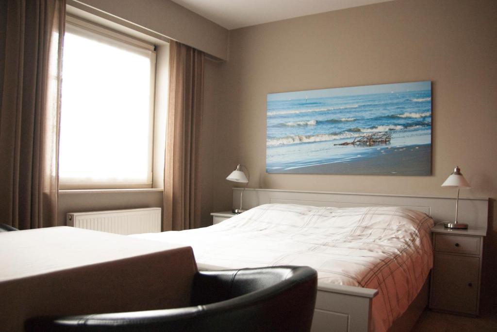 Postel nebo postele na pokoji v ubytování B&B The Beachhouse