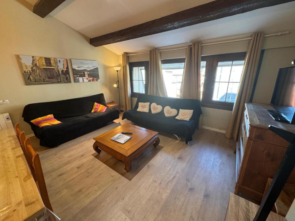 a living room with a couch and a coffee table at Immodelpas Mundial in Pas de la Casa