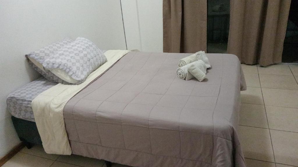 Giường trong phòng chung tại Departamento Céntrico Mendoza