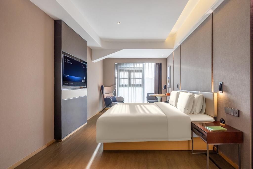 Postel nebo postele na pokoji v ubytování Atour Hotel Xian Bell Tower Yongningli