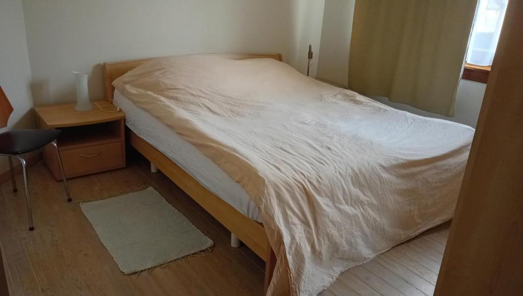 Giường trong phòng chung tại Lieria