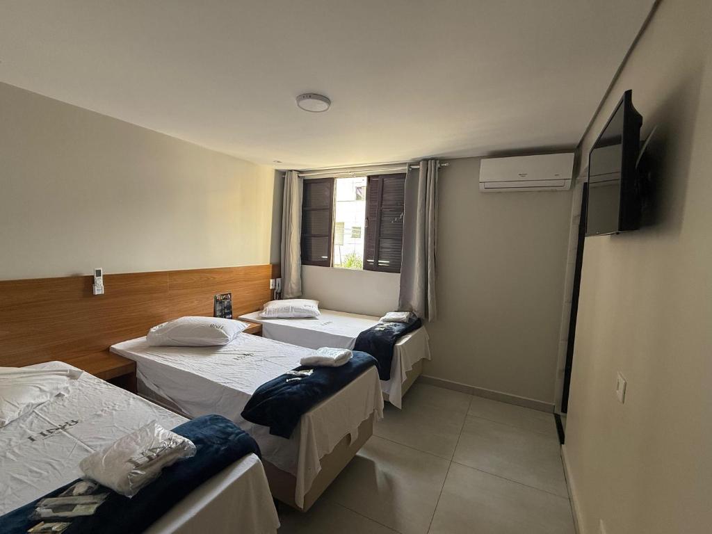 Postel nebo postele na pokoji v ubytování Hotel New Brás