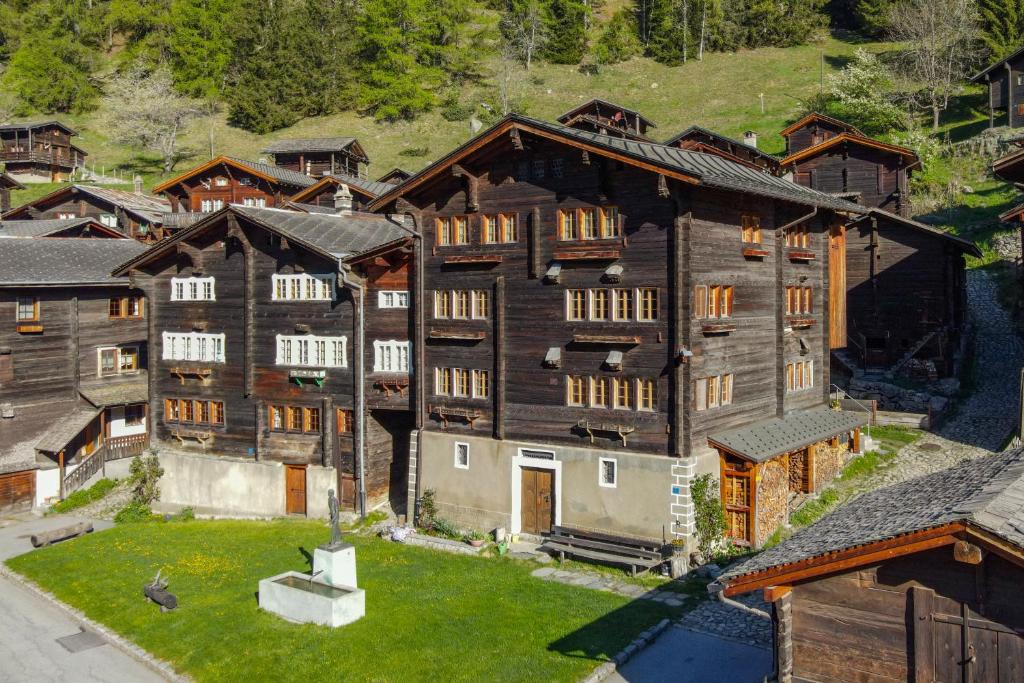 an aerial view of a large wooden house at Ferienwohnung Schleif in Niederwald