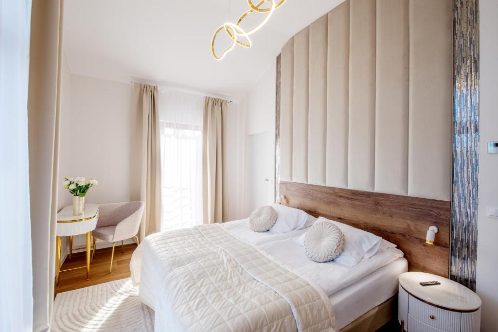 Ένα ή περισσότερα κρεβάτια σε δωμάτιο στο Hotel Magellan