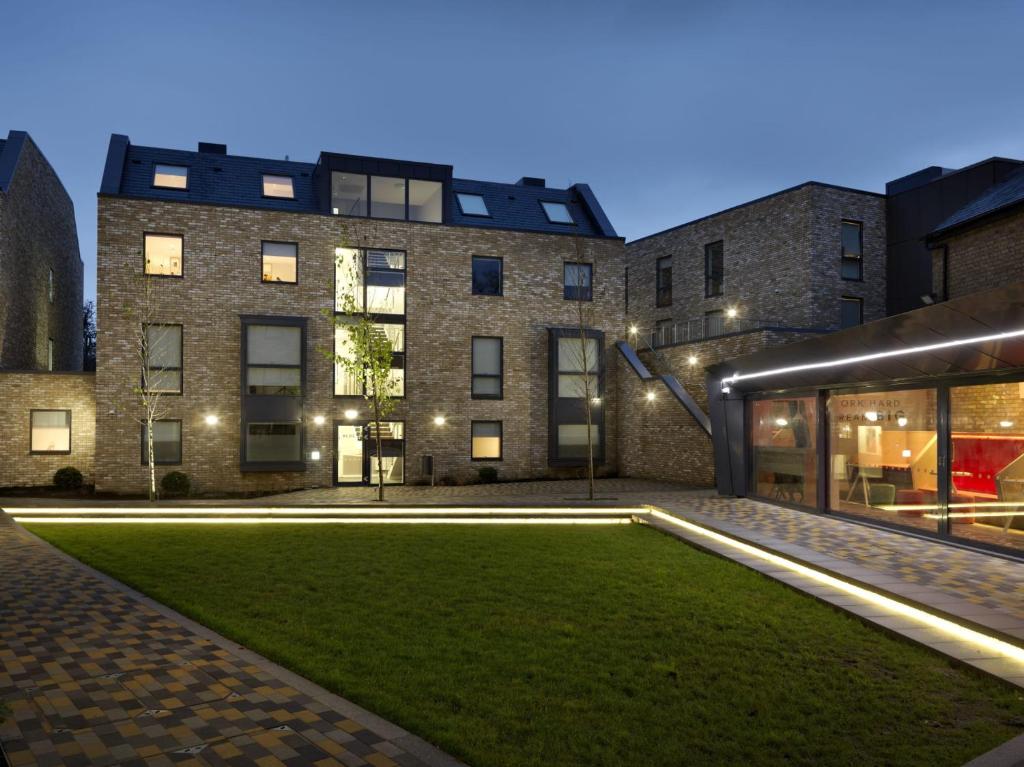 a building with a lawn in front of it at For Students Only - Student Castle Cambridge in Chesterton