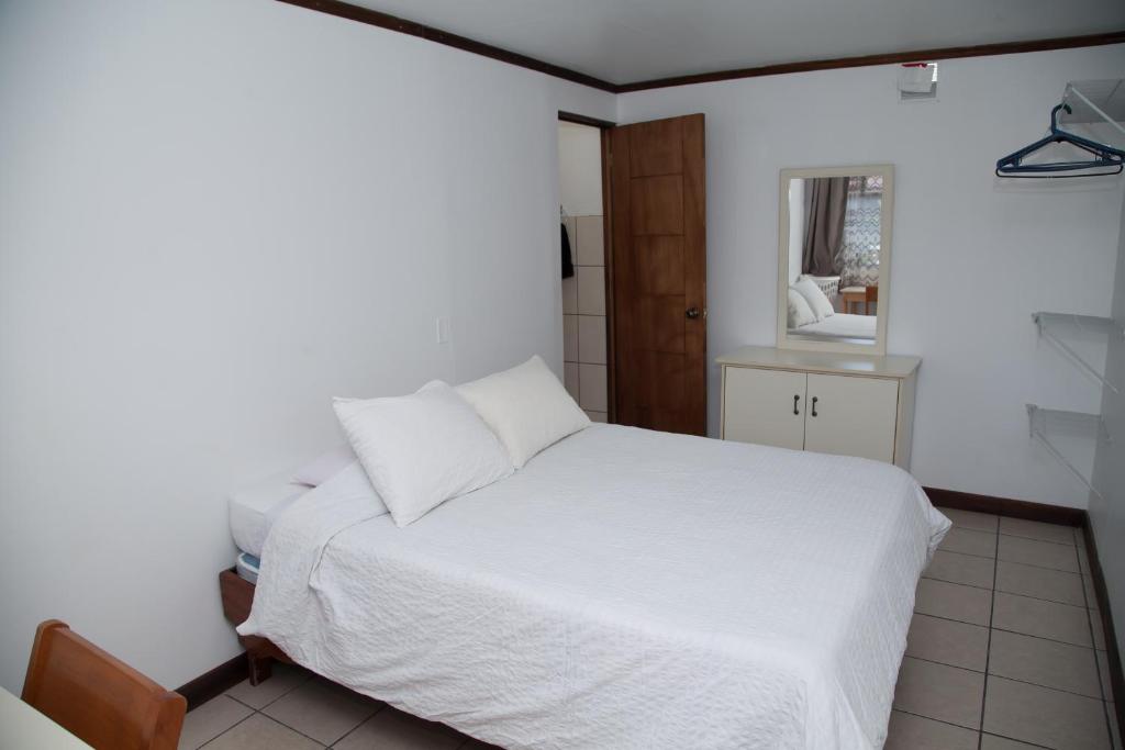 Postel nebo postele na pokoji v ubytování Casa Kibi Kibi