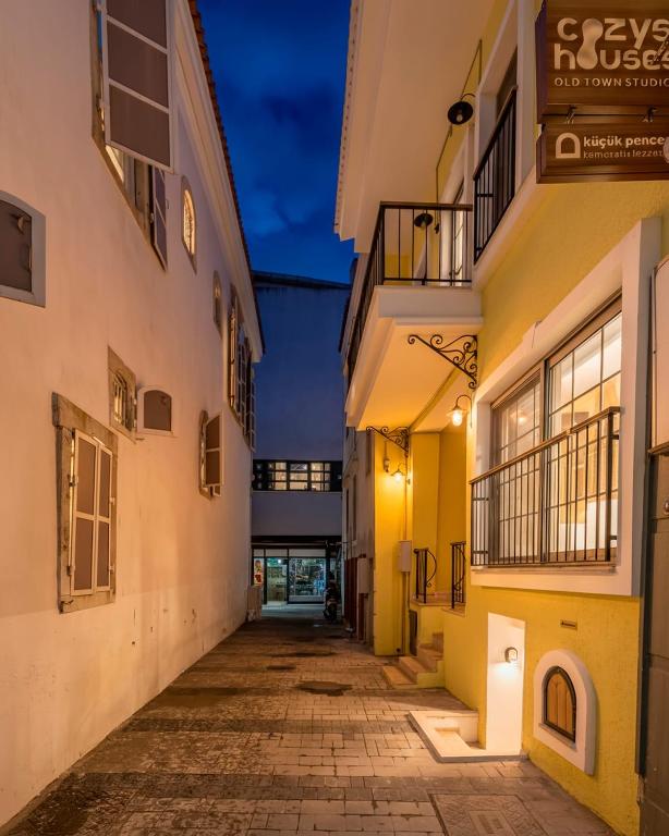 an empty alleyway between two buildings at night at Stone studio just a 3min walk from the Clock Tower in Konak