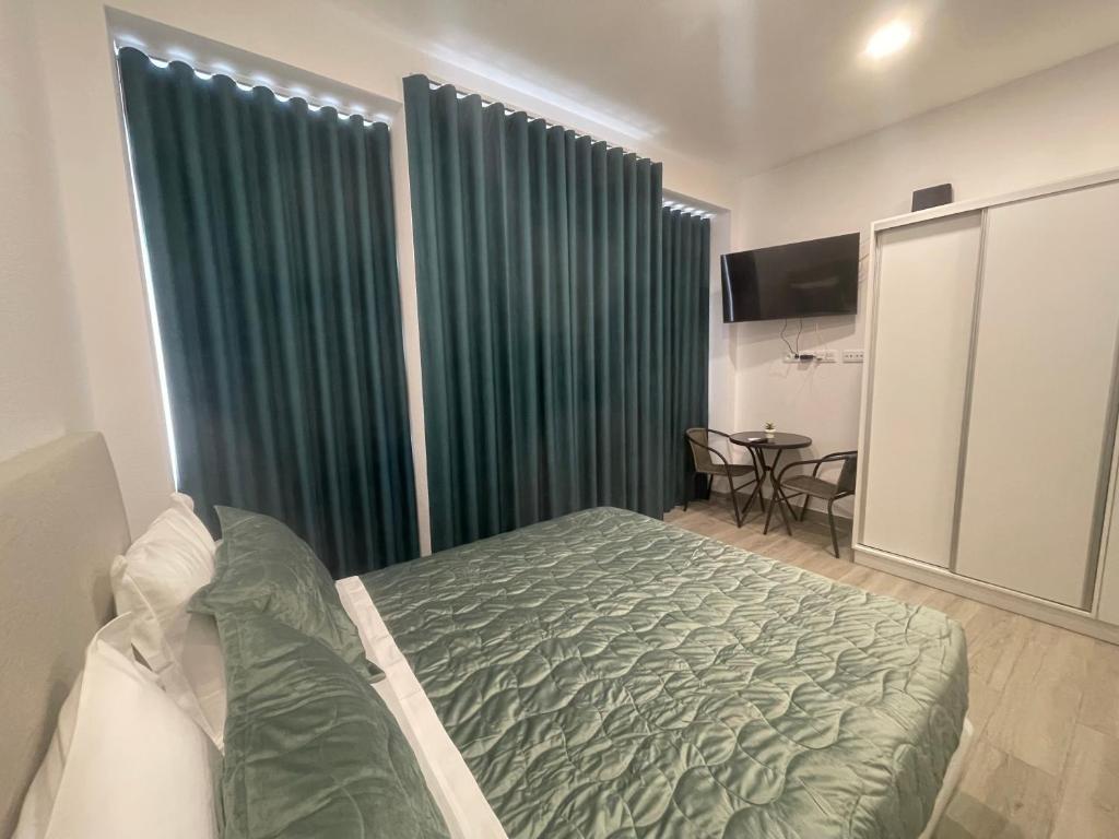 Ένα ή περισσότερα κρεβάτια σε δωμάτιο στο Lord Freitas