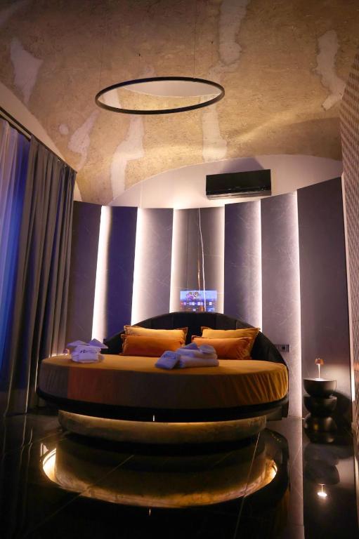 a bedroom with a bed in a room with at Nenna's Suite Room in Scafati
