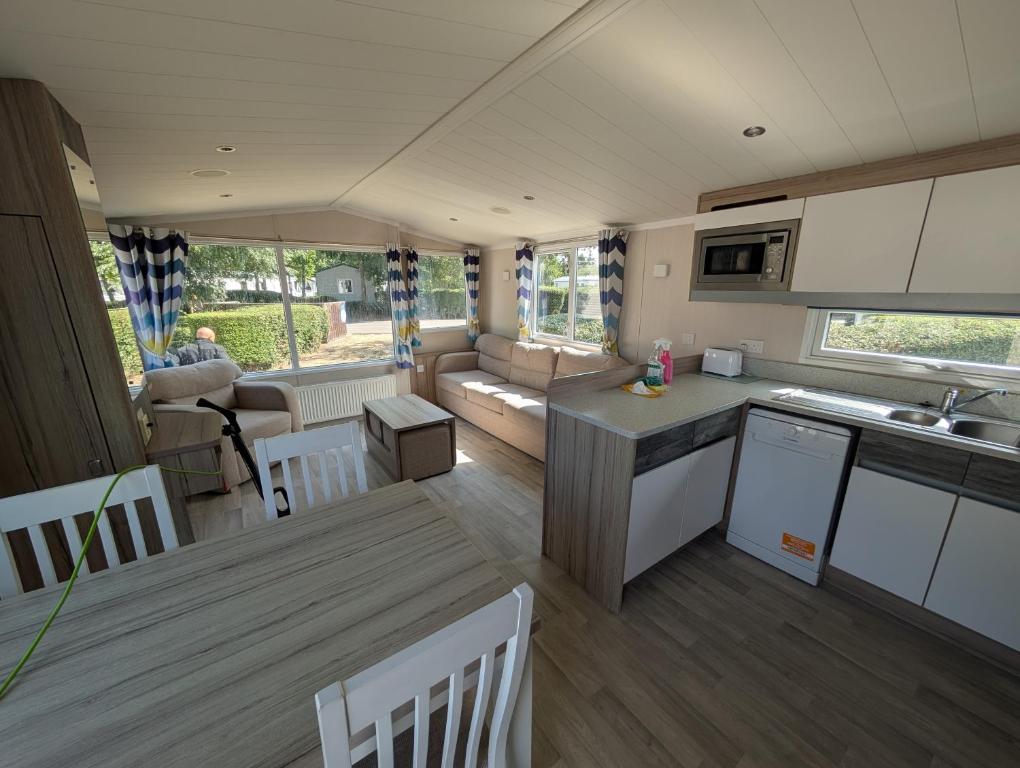 an open kitchen and living room of a caravan at Family Friendly Caravan in Burnham on Sea in Burnham on Sea